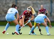 17 March 2024; Caoimhe Perdue of Loreto HC evades the tackle of Aine Naughton, left, and Katherine Egan of UCD LHC during the Jacqui Potter Cup final match between UCD LHC and Loreto HC at Three Rock Rovers Hockey Club in Rathfarnham, Dublin. Photo by Tyler Miller/Sportsfile