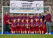 17 March 2024; The Loreto HC panel and staff celebrate with the cup after the Jacqui Potter Cup final match between UCD LHC and Loreto HC at Three Rock Rovers Hockey Club in Rathfarnham, Dublin. Photo by Tyler Miller/Sportsfile