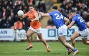 16 March 2024; Stefan Campbell of Armagh in action against Ryan Donohoe and Tiarnan Madden of Cavan during the Allianz Football League Division 2 match between Armagh and Cavan at BOX-IT Athletic Grounds in Armagh.