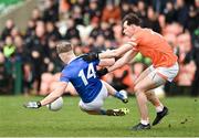 16 March 2024; Paddy Lynch of Cavan in action against Barry McCambridge of Armagh during the Allianz Football League Division 2 match between Armagh and Cavan at BOX-IT Athletic Grounds in Armagh.