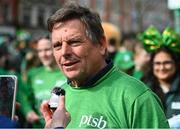 17 March 2024; Team Ireland athlete David Wiliks is interviewed as Team Ireland and PTSB take part in the St. Patrick’s Day Parade on the streets of Dublin as part of the celebrations of 100 years of Team Ireland competing at the Olympic Games.. Photo by Tyler Miller/Sportsfile