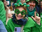 17 March 2024; An attendee is pictured as Team Ireland and PTSB take part in the St. Patrick’s Day Parade on the streets of Dublin as part of the celebrations of 100 years of Team Ireland competing at the Olympic Games.. Photo by Tyler Miller/Sportsfile
