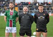17 March 2024; Referee James Molloy with team captains Kevin Maguire of Westmeath, left, and Pierce Laverty of Down before the Allianz Football League Division 3 match between Westmeath and Down at TEG Cusack Park in Mullingar, Westmeath. Photo by Seb Daly/Sportsfile