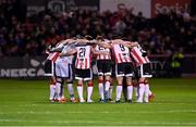 15 March 2024; Derry City players huddle before the SSE Airtricity Men's Premier Division match between Bohemians and Derry City at Dalymount Park in Dublin. Photo by Stephen McCarthy/Sportsfile