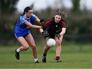 18 March 2024; Ellen Giblin of St Attracta's Community School in action against Kate Carr of Ursuline Secondary School during the 2024 Lidl LGFA All-Ireland Post-Primary Schools Senior B Championship final match between St Attracta’s Community School of Tubbercurry, Sligo, and Ursuline Secondary School of Thurles, Tipperary, at St Aidan’s GAA club in Ballyforan, Roscommon. Photo by Piaras Ó Mídheach/Sportsfile
