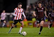 15 March 2024; Adam O'Reilly of Derry City in action against Adam McDonnell of Bohemians during the SSE Airtricity Men's Premier Division match between Bohemians and Derry City at Dalymount Park in Dublin. Photo by Stephen McCarthy/Sportsfile