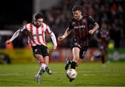 15 March 2024; Adam O'Reilly of Derry City in action against Adam McDonnell of Bohemians during the SSE Airtricity Men's Premier Division match between Bohemians and Derry City at Dalymount Park in Dublin. Photo by Stephen McCarthy/Sportsfile