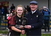18 March 2024; Lauren Normanly of St Attracta's Community School receives the player of the match award from Connacht LGFA president Brendan Cregg after her side's victory in the 2024 Lidl LGFA All-Ireland Post-Primary Schools Senior B Championship final match between St Attracta’s Community School of Tubbercurry, Sligo, and Ursuline Secondary School of Thurles, Tipperary, at St Aidan’s GAA club in Ballyforan, Roscommon. Photo by Piaras Ó Mídheach/Sportsfile