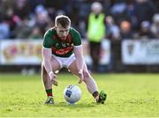 17 March 2024; Ryan O'Donoghue of Mayo takes the ball off the kicking tee of Derry goalkeeper Odhran Lynch, after referee Seán Lonergan cancelled Derry's kick-out due to a delay in taking it, during the Allianz Football League Division 1 match between Mayo and Derry at Hastings Insurance MacHale Park in Castlebar, Mayo. Photo by Piaras Ó Mídheach/Sportsfile