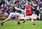 17 March 2024; Brendan Rogers of Derry in action against Donnacha McHugh of Mayo during the Allianz Football League Division 1 match between Mayo and Derry at Hastings Insurance MacHale Park in Castlebar, Mayo. Photo by Piaras Ó Mídheach/Sportsfile