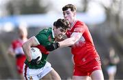 17 March 2024; Tommy Conroy of Mayo in action against Padraig McGrogan of Derry during the Allianz Football League Division 1 match between Mayo and Derry at Hastings Insurance MacHale Park in Castlebar, Mayo. Photo by Piaras Ó Mídheach/Sportsfile