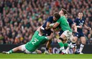 16 March 2024; Andy Christie of Scotland is tackled by Dan Sheehan, left, and Jack Crowley of Ireland during the Guinness Six Nations Rugby Championship match between Ireland and Scotland at the Aviva Stadium in Dublin. Photo by Sam Barnes/Sportsfile