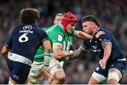 16 March 2024; Josh van der Flier of Ireland in action against Rory Sutherland, right, and Andy Christie of Scotland during the Guinness Six Nations Rugby Championship match between Ireland and Scotland at the Aviva Stadium in Dublin. Photo by Sam Barnes/Sportsfile