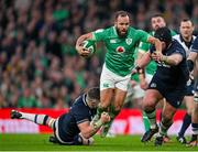 16 March 2024; Jamison Gibson-Park of Ireland is tackled by Jack Dempsey of Scotland, left, during the Guinness Six Nations Rugby Championship match between Ireland and Scotland at the Aviva Stadium in Dublin. Photo by Sam Barnes/Sportsfile