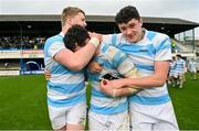 17 March 2024; Blackrock College captain Jack Angulo, centre, celebrates with team-mates Louis Magee, left, and Geoffrey Wall after their side's victory in the Bank of Ireland Leinster Schools Senior Cup final match between Blackrock College and St Michael's College at the RDS Arena in Dublin. Photo by Sam Barnes/Sportsfile