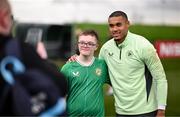 19 March 2024; Republic of Ireland goalkeeper Gavin Bazunu with Keigan Taylor, from Derry, of the Ireland Down Syndrome Futsal squad on a visit to a Republic of Ireland training session at the FAI National Training Centre in Abbotstown, Dublin. Photo by Stephen McCarthy/Sportsfile