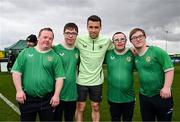 19 March 2024; Republic of Ireland's Seamus Coleman with, from left, Hughie Sweeney, from Gweedore, Donegal, Fergus Cosgrove, from Navan, Meath, Daniel O'Reilly, from Letterkenny, Donegal, and David Crawford, from Donegal Town, of the Ireland Down Syndrome Futsal squad on a visit to a Republic of Ireland training session at the FAI National Training Centre in Abbotstown, Dublin. Photo by Stephen McCarthy/Sportsfile