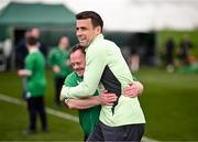 19 March 2024; Republic of Ireland's Seamus Coleman with Hughie Sweeney, from Gweedore, Donegal, of the Ireland Down Syndrome Futsal squad on a visit to a Republic of Ireland training session at the FAI National Training Centre in Abbotstown, Dublin. Photo by Stephen McCarthy/Sportsfile