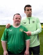 19 March 2024; Republic of Ireland's Seamus Coleman with Hughie Sweeney, from Gweedore, Donegal, of the Ireland Down Syndrome Futsal squad on a visit to a Republic of Ireland training session at the FAI National Training Centre in Abbotstown, Dublin. Photo by Stephen McCarthy/Sportsfile