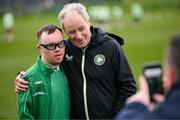 19 March 2024; Republic of Ireland's technical advisor Brian Kerr and Josh Hennessy, from The Liberties, Dublin, a member of the Ireland Down Syndrome Futsal squad on a visit to a Republic of Ireland training session at the FAI National Training Centre in Abbotstown, Dublin. Photo by Stephen McCarthy/Sportsfile