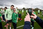 19 March 2024; Republic of Ireland's Seamus Coleman with Josh Hennessy, from The Liberties, Dublin of the Ireland Down Syndrome Futsal squad on a visit to a Republic of Ireland training session at the FAI National Training Centre in Abbotstown, Dublin. Photo by Stephen McCarthy/Sportsfile