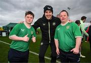 19 March 2024; Republic of Ireland interim head coach John O'Shea with Cian Kelleher, from Mallow, Cork, and Hughie Sweeney, from Gweedore, Donegal, right, of the Ireland Down Syndrome Futsal squad on a visit to a Republic of Ireland training session at the FAI National Training Centre in Abbotstown, Dublin. Photo by Stephen McCarthy/Sportsfile