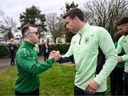 19 March 2024; Republic of Ireland's Seamus Coleman meets Josh Hennessy, from The Liberties, Dublin, of the Ireland Down Syndrome Futsal squad on a visit to a Republic of Ireland training session at the FAI National Training Centre in Abbotstown, Dublin. Photo by Stephen McCarthy/Sportsfile