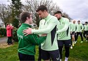 19 March 2024; Republic of Ireland's Seamus Coleman meets David Crawford, from Donegal Town, of the Ireland Down Syndrome Futsal squad on a visit to a Republic of Ireland training session at the FAI National Training Centre in Abbotstown, Dublin. Photo by Stephen McCarthy/Sportsfile