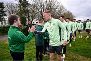 19 March 2024; Republic of Ireland's Mark Sykes meets members of the Ireland Down Syndrome Futsal squad on a visit to a Republic of Ireland training session at the FAI National Training Centre in Abbotstown, Dublin. Photo by Stephen McCarthy/Sportsfile