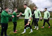 19 March 2024; Republic of Ireland goalkeepers, from left, Mark Travers, Caoimhin Kelleher and Brian Maher meet members of the Ireland Down Syndrome Futsal squad on a visit to a Republic of Ireland training session at the FAI National Training Centre in Abbotstown, Dublin. Photo by Stephen McCarthy/Sportsfile