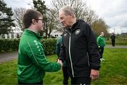 19 March 2024; Republic of Ireland technical advisor Brian Kerr meets David Crawford, from Donegal Town, of the Ireland Down Syndrome Futsal squad on a visit to a Republic of Ireland training session at the FAI National Training Centre in Abbotstown, Dublin. Photo by Stephen McCarthy/Sportsfile