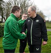 19 March 2024; Republic of Ireland technical advisor Brian Kerr meets Jamie Linden, from Dundalk, Louth, of the Ireland Down Syndrome Futsal squad on a visit to a Republic of Ireland training session at the FAI National Training Centre in Abbotstown, Dublin. Photo by Stephen McCarthy/Sportsfile