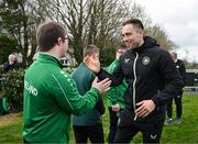 19 March 2024; Republic of Ireland analyst Stephen Rice meets David Crawford, from Donegal Town, of the Ireland Down Syndrome Futsal squad on a visit to a Republic of Ireland training session at the FAI National Training Centre in Abbotstown, Dublin. Photo by Stephen McCarthy/Sportsfile