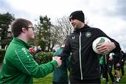 19 March 2024; Republic of Ireland interim head coach John O'Shea meets David Crawford, from Donegal Town, of the Ireland Down Syndrome Futsal squad on a visit to a Republic of Ireland training session at the FAI National Training Centre in Abbotstown, Dublin. Photo by Stephen McCarthy/Sportsfile
