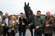 19 March 2024; Galopin Des Champs with, from left, owners Greg and Audrey Turley, jockey Paul Townend, groom Adam Connolly and trainer Willie Mullins during the homecoming of Cheltenham Gold Cup winner Galopin Des Champs at Leighlinbridge in Carlow. Photo by Tyler Miller/Sportsfile