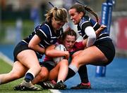 20 March 2024; Eimear Doonan of Loreto Mullingar is tackled into touch by Rachel Dempsey, left, and Niamh Dempsey of Loreto Wexford during the Bank of Ireland Girls Senior Schools Cup final match between Loreto Wexford and Loreto Mullingar at Energia Park in Dublin. Photo by Harry Murphy/Sportsfile