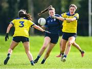 20 March 2024; Caoimhe Kelly of Our Lady's Secondary School in action against Alana McDonnell, left, and Beth Hoban of Sacred Heart School during the 2024 Lidl LGFA All-Ireland Post-Primary Schools Senior A final match between Our Lady’s Secondary School of Castleblaney, Monaghan, and Sacred Heart School of Westport, Mayo, at St Rynagh’s GAA club in Banagher, Offaly. Photo by Tyler Miller/Sportsfile