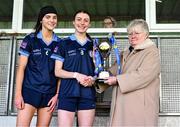 20 March 2024; Hazel Hughes, centre, and Laura Grimes of Our Lady's Secondary School are presented with the cup by Geraldine Carey, representing the LGFA, after the 2024 Lidl LGFA All-Ireland Post-Primary Schools Senior A final match between Our Lady’s Secondary School of Castleblaney, Monaghan, and Sacred Heart School of Westport, Mayo, at St Rynagh’s GAA club in Banagher, Offaly. Photo by Tyler Miller/Sportsfile