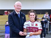 20 March 2024; Mia Bennett of St Columba's Comprehensive School receives the player of the match award from Connacht LGFA president Brendan Cregg after the Lidl LGFA All-Ireland Post Primary School Senior C Championship final match between St Columba's Comprehensive School of Glenties, Donegal, and Dunmore Community School in Galway at Kilcoyne Park in Tubbercurry, Sligo. Photo by Piaras Ó Mídheach/Sportsfile