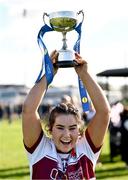 20 March 2024; St Columba's Comprehensive School captain Mia Bennett lifts the cup after her side's victory in the Lidl LGFA All-Ireland Post Primary School Senior C Championship final match between St Columba's Comprehensive School of Glenties, Donegal, and Dunmore Community School in Galway at Kilcoyne Park in Tubbercurry, Sligo. Photo by Piaras Ó Mídheach/Sportsfile