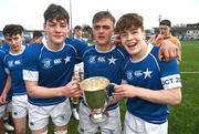 20 March 2024; James Whitty, left, Eoghan Brady, and Nic Sheehan of St Mary’s College lift the cup after the Bank of Ireland Leinster Schools Junior Cup final match between St Mary's College and Terenure College at Energia Park in Dublin. Photo by Daire Brennan/Sportsfile