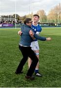 20 March 2024; Eoin Farrell of St Mary’s College celebrates with his dad Peter after the Bank of Ireland Leinster Schools Junior Cup final match between St Mary's College and Terenure College at Energia Park in Dublin. Photo by Daire Brennan/Sportsfile