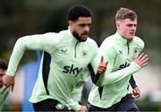 21 March 2024; Evan Ferguson and Andrew Omobamidele, left, during a Republic of Ireland training session at the FAI National Training Centre in Abbotstown, Dublin. Photo by Stephen McCarthy/Sportsfile