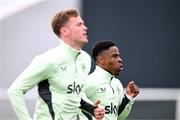21 March 2024; Chiedozie Ogbene and Evan Ferguson, left, during a Republic of Ireland training session at the FAI National Training Centre in Abbotstown, Dublin. Photo by Stephen McCarthy/Sportsfile