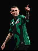 21 March 2024; Nathan Aspinall celebrates scoring a '180' during his match against Rob Cross at the BetMGM Premier League Darts at the 3Arena in Dublin. Photo by Ben McShane/Sportsfile