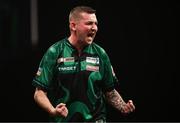 21 March 2024; Nathan Aspinall celebrates after winning a leg during his match against Rob Cross at the BetMGM Premier League Darts at the 3Arena in Dublin. Photo by Ben McShane/Sportsfile