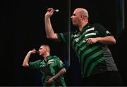 21 March 2024; (EDITORS NOTE: Image created using the multiple exposure function in camera) Rob Cross, right, and Nathan Aspinall in action during their match at the BetMGM Premier League Darts at the 3Arena in Dublin. Photo by Ben McShane/Sportsfile