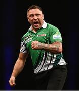 21 March 2024; Gerwyn Price celebrates after winning a leg during his match against Michael van Gerwen at the BetMGM Premier League Darts at the 3Arena in Dublin. Photo by Ben McShane/Sportsfile