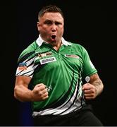 21 March 2024; Gerwyn Price celebrates after winning a leg during his match against Michael van Gerwen at the BetMGM Premier League Darts at the 3Arena in Dublin. Photo by Ben McShane/Sportsfile