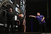 21 March 2024; Luke Littler in action against Michael Smith during their match at the BetMGM Premier League Darts at the 3Arena in Dublin. Photo by Ben McShane/Sportsfile